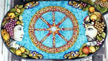 Art: TROF-105 Tavolo in pietra lavica ovale con decoro limoni, ruota di carretto siciliano, coppia di mori e bordo intagliato a rilievo