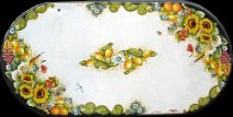 art: TROFF-016 Tavolo in pietra lavica ovale con decoro limoni, fiori di zagara, papaveri, spighe di grano, girasoli, uva, arance, calle, insetti e bordo intagliato a rilievo
